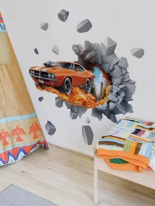 Detail showing 3D wall sticker of an orange racing car with flames in a nursery room