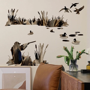 Hunting theme wall decal featuring duck silhouettes and hunter in a scenic room