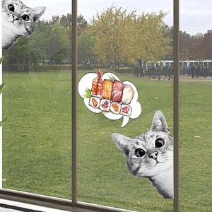 Playful peeking cats and sushi wall decals on a window with a green park background