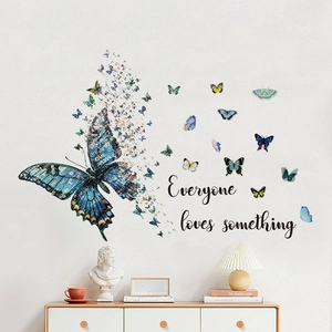 Blue butterfly wall stickers with 'Everyone loves something' text for home wall decor