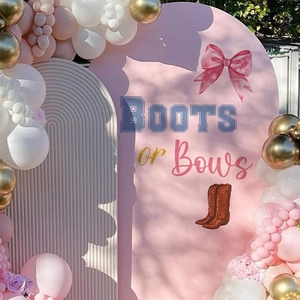 Pink Boots or Bows Gender Reveal party backdrop with balloons and double arch decorations