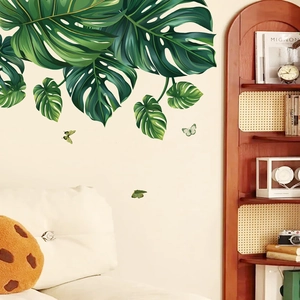 Adesivi murali con foglie di monstera e farfalle verdi per l'arredo accogliente della camera