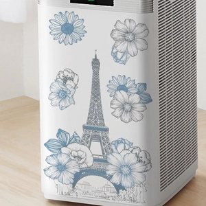 Eiffel Tower and flower wall stickers applied on home appliance in minimalist room