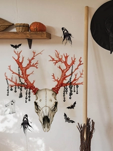 Detail of Halloween sheep skull wall sticker with red antlers and black ghost bats decorations
