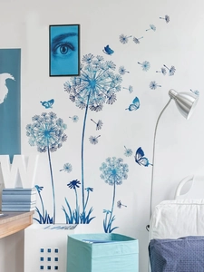 Detailed view of blue dandelion wall stickers with flying butterflies on white room wall