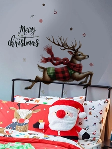Detail of Christmas reindeer wall sticker with red plaid scarf on bedroom wall