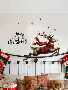 Detailed view of running reindeer wall decal with Merry Christmas text for bedroom decor