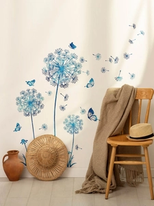 Blue dandelion wall stickers with flying seeds and butterflies on warm beige wall decor