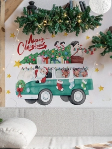 Detail of Christmas Santa bus wall decal showing watercolor art above a living room sofa