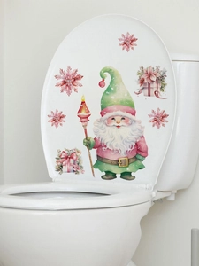 Detail van aquarel kerstkabouter en roze sneeuwvlok stickers op een witte toiletdeksel