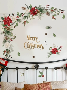 Dettaglio di adesivi murali Buon Natale con scritte dorate ed elementi di ghirlanda floreale