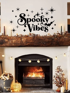 Detail view of Spooky Vibes Halloween wall decal with stars and bat silhouettes on a white wall
