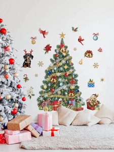 Detail of Christmas tree wall stickers with cute dogs and gift boxes on a white wall