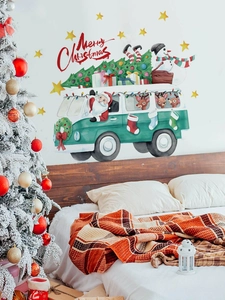Detailed Santa Claus bus wall decal with Merry Christmas text on a cozy bedroom wall