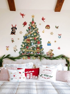 Bedroom wall featuring Christmas tree stickers with dachshund, golden retriever, and snowflakes