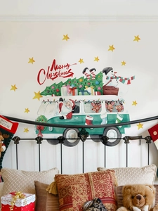 Detail of Christmas Santa bus wall decal with tree and snowman in bedroom setting