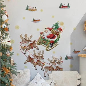 Stickers muraux de Noël avec traîneau du Père Noël au-dessus d'une maison de neige