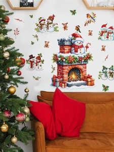 Close-up of Christmas snowman fireplace wall decals applied in a cozy home living room