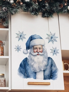 Detail view of a watercolor blue Santa Claus wall sticker on a white cabinet door decoration