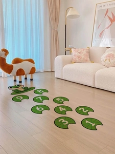 Cartoon frog hopscotch floor stickers with numbers 1 to 9 in a cozy living room decor
