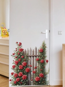 Detail view of red rose and wooden fence wall sticker on a white interior door