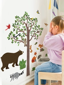 Detail of forest animal wall stickers with a large tree, bear, fox and owl for kids room