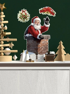 Detail of Christmas wall stickers featuring Santa, wreaths and bells on a white tabletop