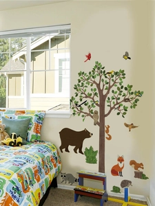 Detailed wall decals set featuring a large cartoon tree and various forest animals in a nursery