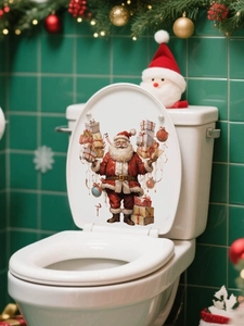 Close-up of Santa Claus wall sticker with gifts on a bathroom toilet lid decor