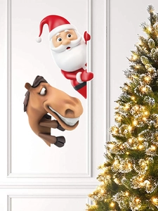 Detailed view of Santa and horse fence peeker decorations on wall next to a lit Christmas tree