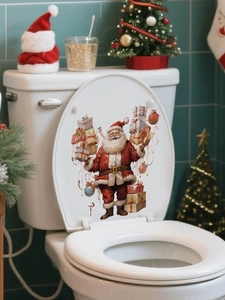 Detail of Santa Claus toilet lid decal with colorful gifts in a festive bathroom setting
