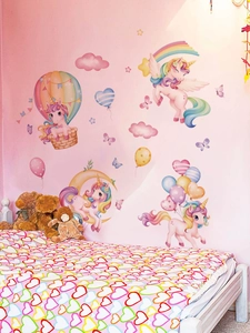 Detail of unicorn wall stickers with hot air balloons and moon in a nursery setting