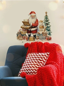 Detail der Weihnachts-Wandtattoo mit Weihnachtsmann und Baum über einem festlichen Sofa