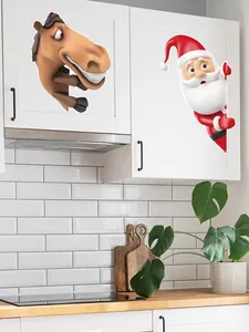 Detailed view of funny cartoon Santa and horse PVC stickers on a modern kitchen cabinet