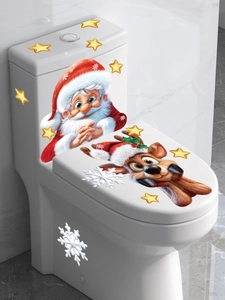 Detail view of Santa and reindeer self-adhesive stickers on a white bathroom toilet tank