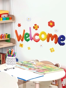 Detail showing 3D rainbow welcome wall stickers with colorful balloon letters and flowers