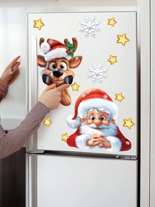 Detail of Christmas Santa and reindeer wall stickers applied on a white surface