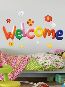 Close-up of 3D colorful balloon wall stickers with Welcome text and floral accents