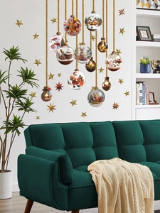 Detail of Christmas wall decals with Santa, snowman and fox ornaments on white wall