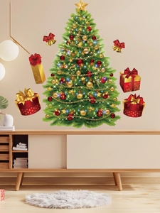 Detail of Christmas tree wall sticker with gift boxes and ornaments on a beige wall