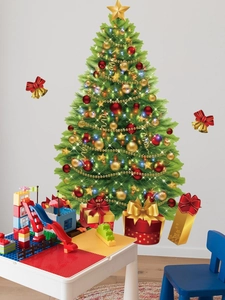 Detail view of festive PVC Christmas tree wall stickers with gift boxes in a kids room