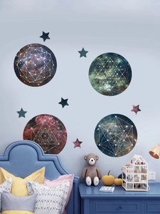 Detail of galaxy sacred geometry wall stickers with nebula patterns in a cozy bedroom