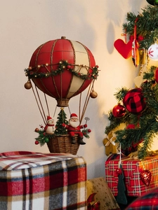 Close-up of Santa and snowman in a hot air balloon with LED lights and a woven basket