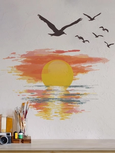 Detail showing sunset seascape wall sticker with flying birds on a textured white wall