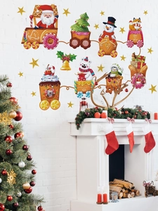 Détail de stickers de Noël avec le Père Noël dans un train de bonbons et petits animaux