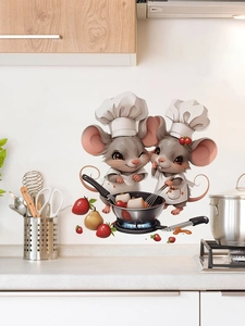 Detail showing cartoon mouse chef wall stickers on a tiled kitchen surface