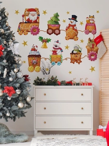 Stickers muraux train de Noël avec Père Noël sur mur blanc décor de fête