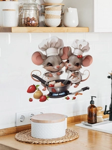 Detailed view of cartoon chef mice wall stickers on a white tiled kitchen backsplash