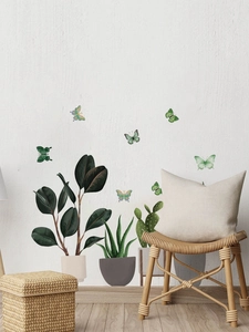 Detailed view of green potted plant wall decals with colorful butterflies for living room