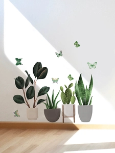 Detail of adhesive wall decals featuring potted green plants and colorful butterflies